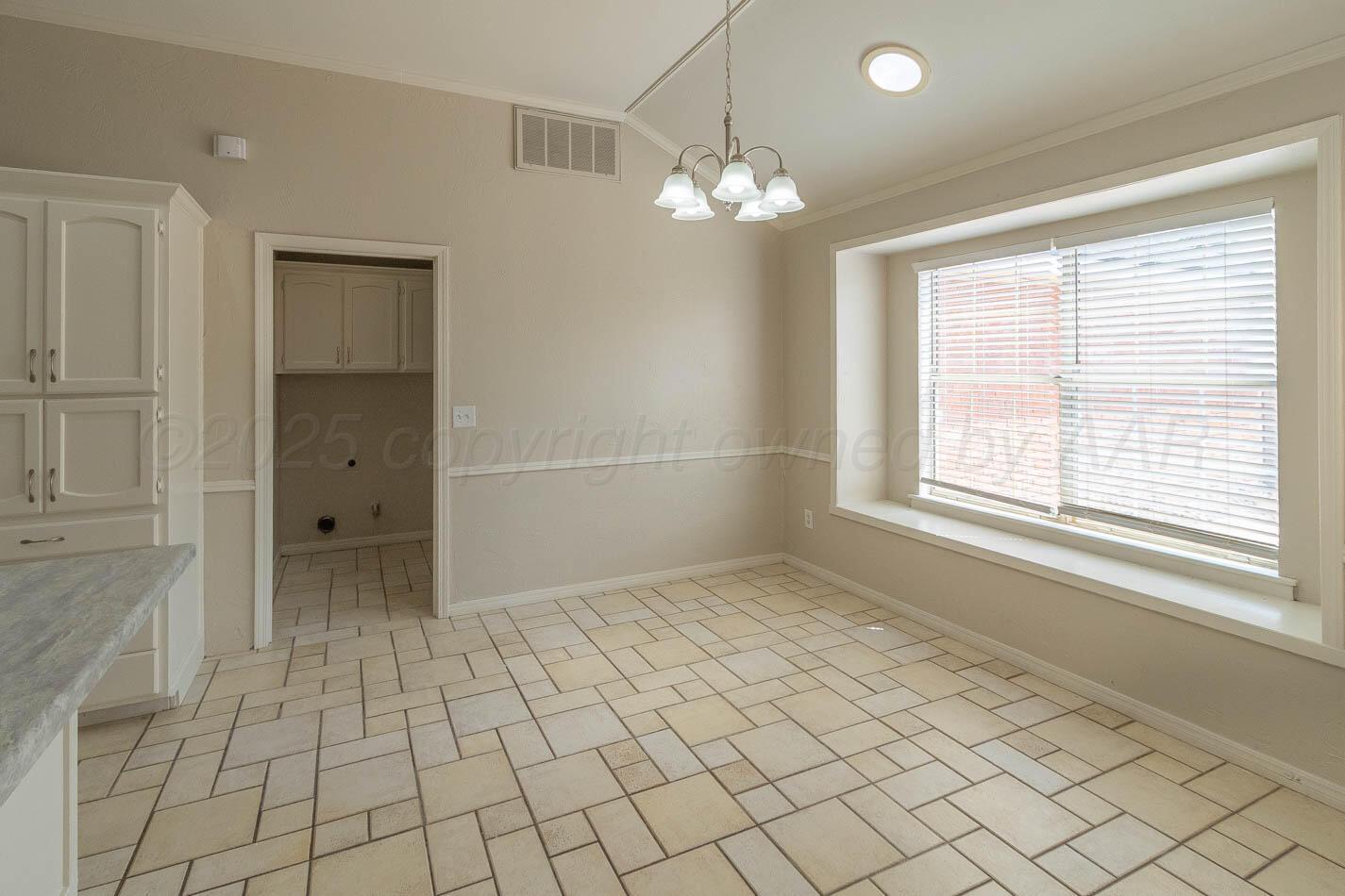 7209 Dukes Place Amarillo, TX 79109 - Photo 6 of 20 a view of an empty room with window
