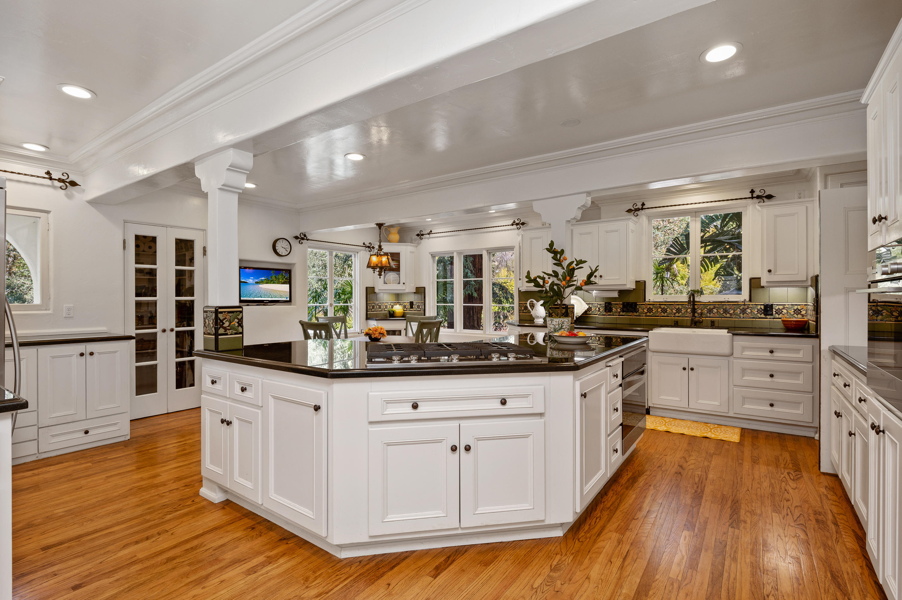 1422 East Palm Street Altadena, CA 91001 - Photo 17 of 64 a kitchen with granite countertop a sink and cabinets