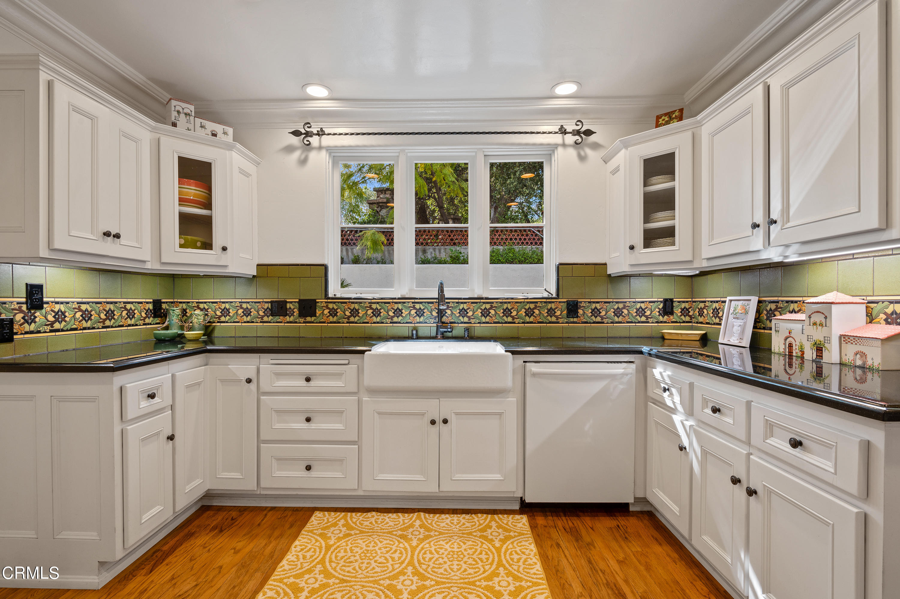 1422 East Palm Street Altadena, CA 91001 - Photo 21 of 64 a kitchen with granite countertop white cabinets white appliances a sink and a window