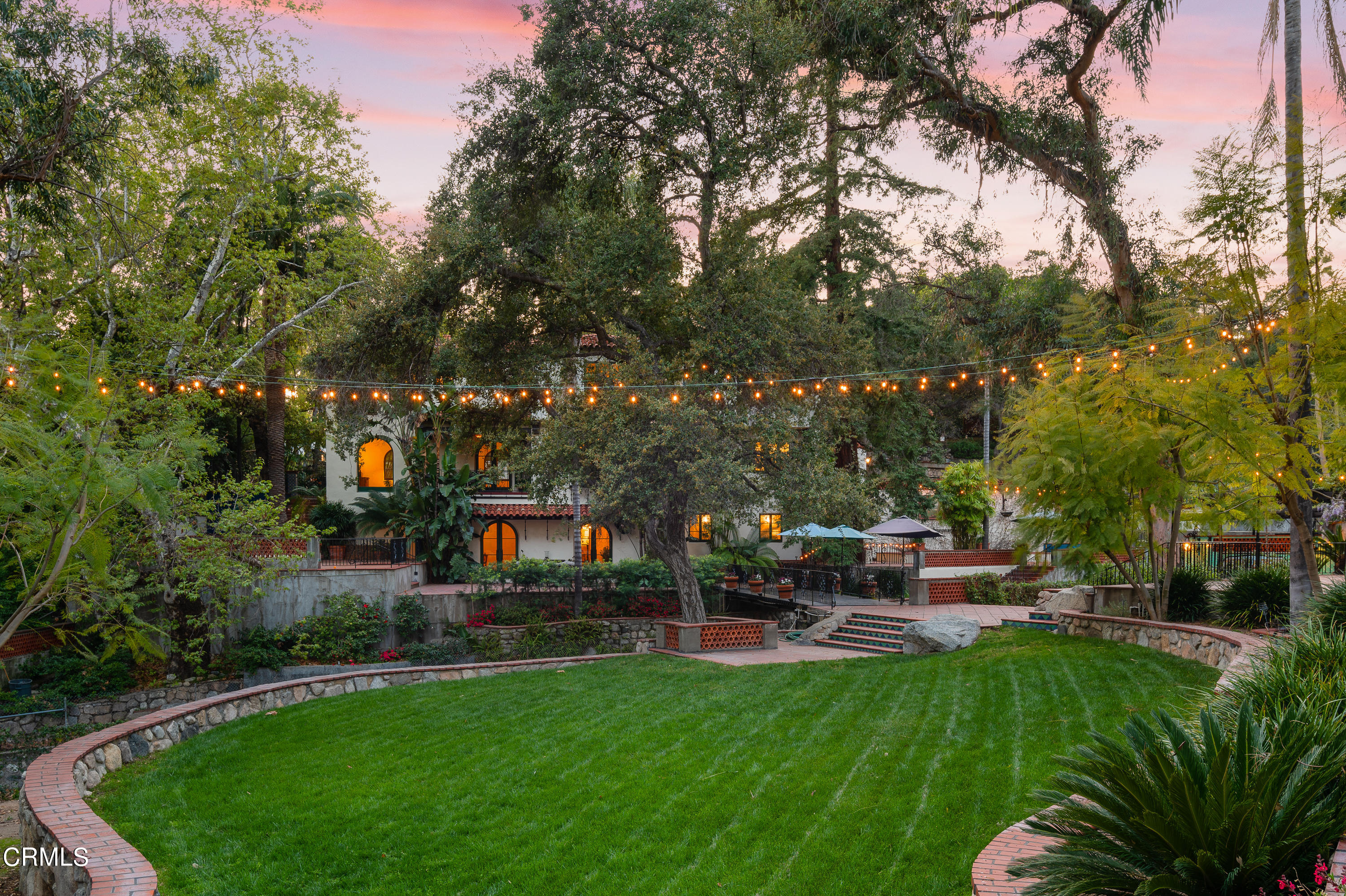1422 East Palm Street Altadena, CA 91001 - Photo 57 of 64 a view of a patio with couches and table and chairs with plants and trees