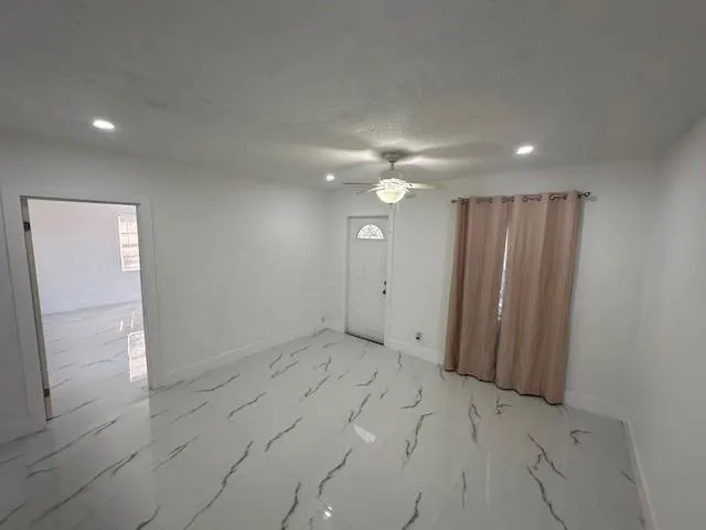 a view of a livingroom with a furniture