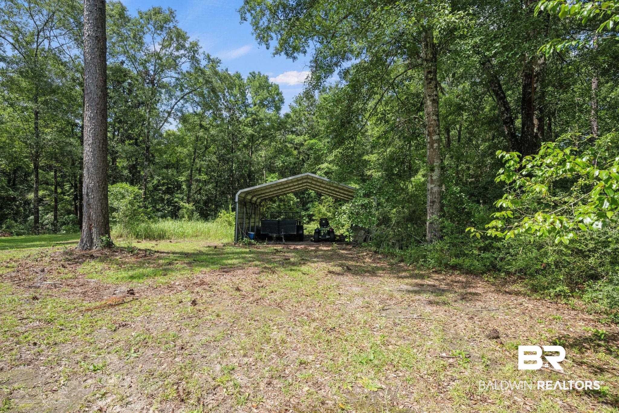 5618 Leytham Road Theodore, AL 36582 - Photo 52 of 60 View of yard featuring a carport
