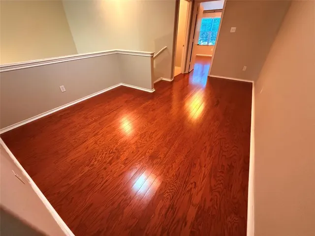 a view of an entryway with wooden floor