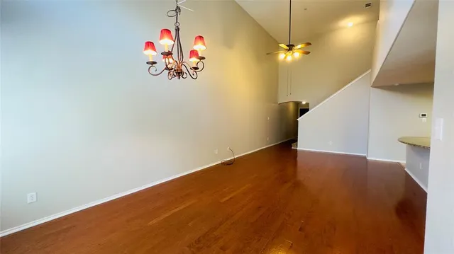 a view of a room with wooden floor
