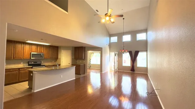 a view of a kitchen with a sink wooden floor and a kitchen