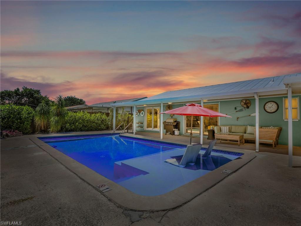 1268 Lake Shore Drive Naples, FL 34103 - Photo 20 of 23 Enjoy the sunset to the west while soaking on the sunshelf.