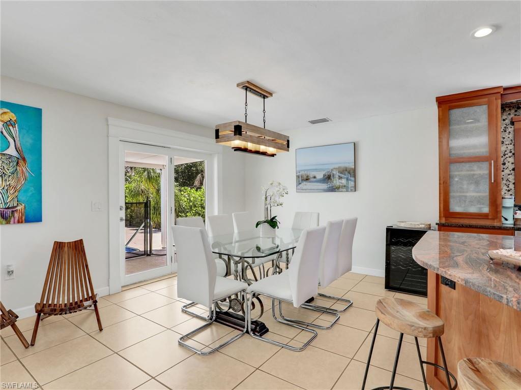 1268 Lake Shore Drive Naples, FL 34103 - Photo 4 of 23 Dining area overlooking the pool.
