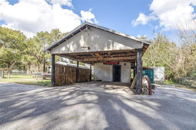 a view of a house with basketball court