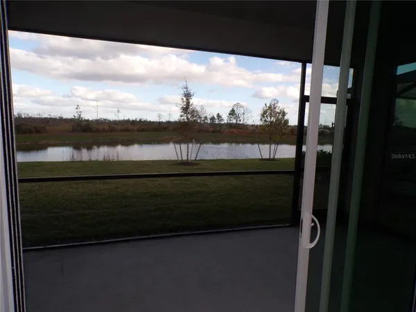a view of a lake from a balcony