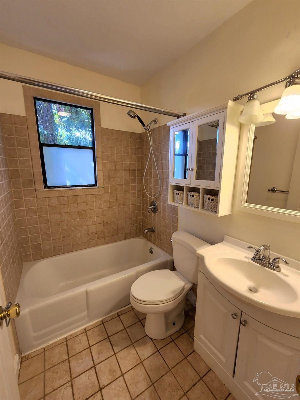 206 Berry Road Pensacola, FL 32507 - Photo 15 of 17 a bathroom with a sink toilet and shower