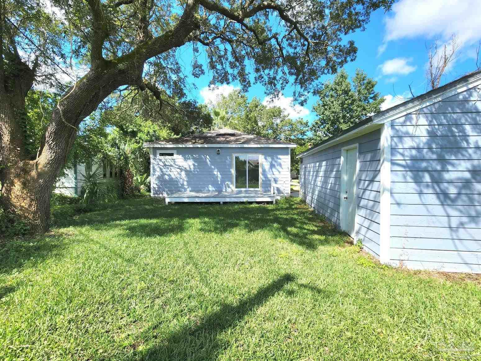 206 Berry Road Pensacola, FL 32507 - Photo 17 of 17 a front view of house with yard and green space