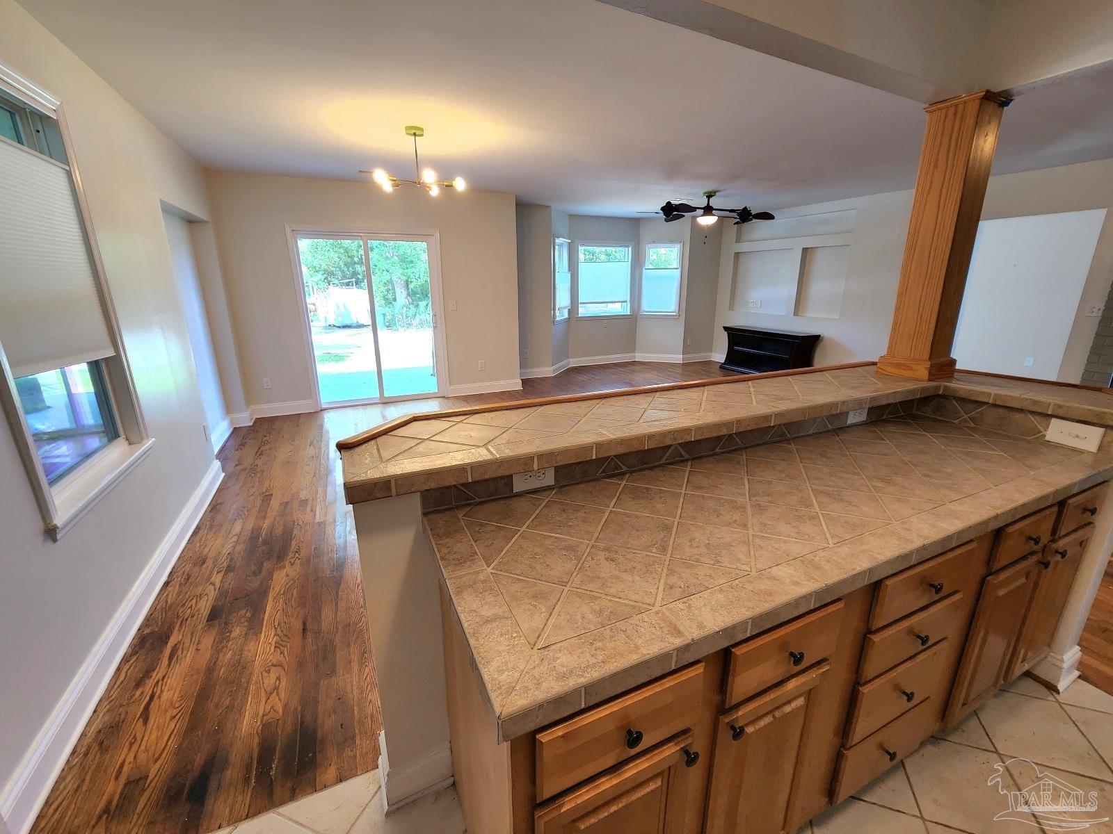 206 Berry Road Pensacola, FL 32507 - Photo 3 of 17 a living room with stainless steel appliances kitchen island a large counter space a sink and a window