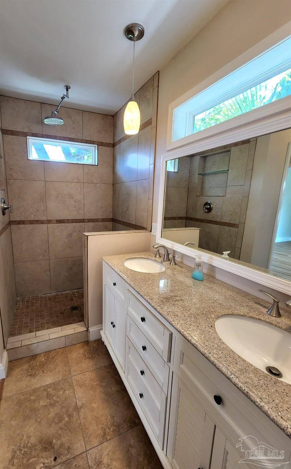 206 Berry Road Pensacola, FL 32507 - Photo 10 of 17 a bathroom with a granite countertop sink mirror and double