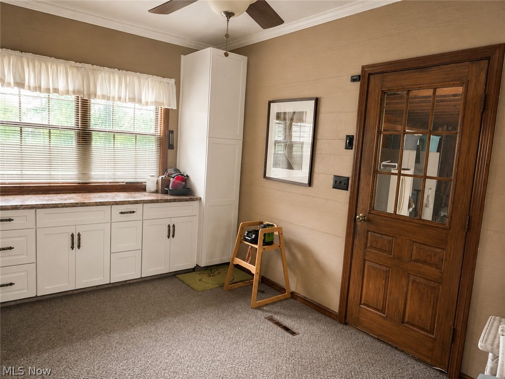 6155 Gibson Road Canfield, OH 44406 - Photo 23 of 43 Breezeway with carpet and entry to the garage