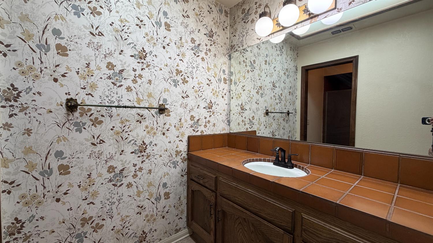1555 West Boston Avenue, Unit 101 Fresno, CA 93711 - Photo 12 of 20 a bathroom with a sink and a mirror