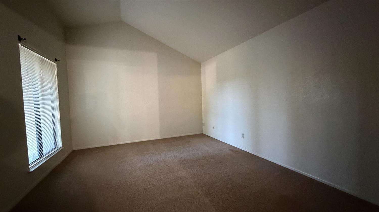 1555 West Boston Avenue, Unit 101 Fresno, CA 93711 - Photo 13 of 20 a view of a small space with wooden floor and a window