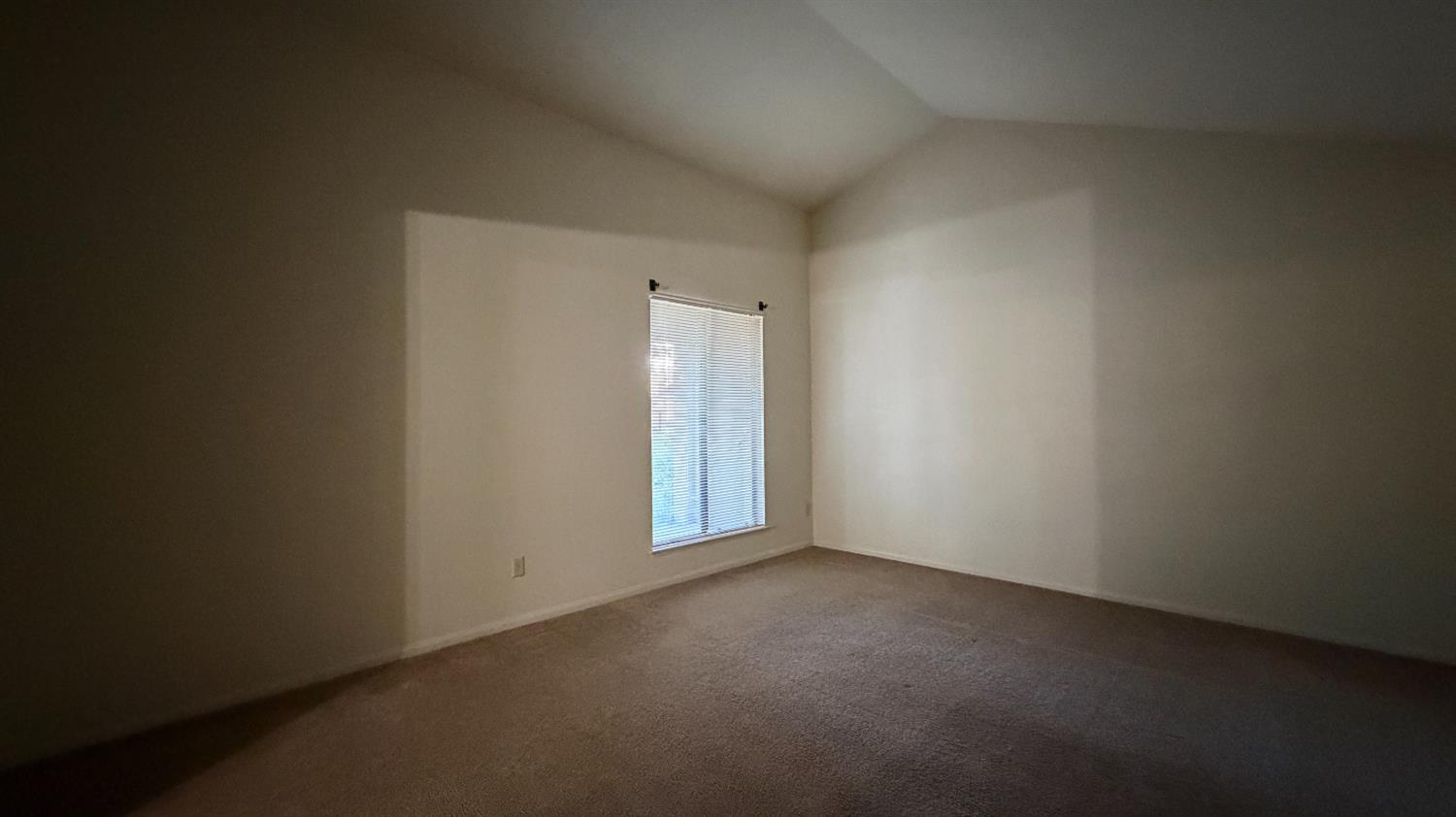 1555 West Boston Avenue, Unit 101 Fresno, CA 93711 - Photo 14 of 20 a view of an empty room and window