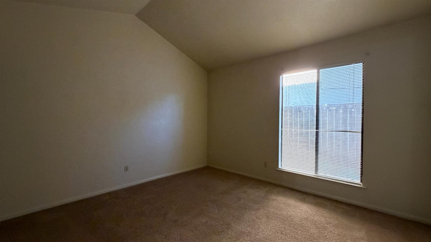 1555 West Boston Avenue, Unit 101 Fresno, CA 93711 - Photo 17 of 20 an empty room with sliding door