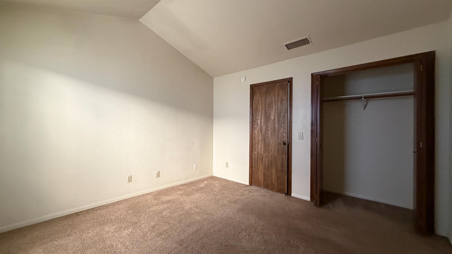 1555 West Boston Avenue, Unit 101 Fresno, CA 93711 - Photo 18 of 20 an empty room with closet area