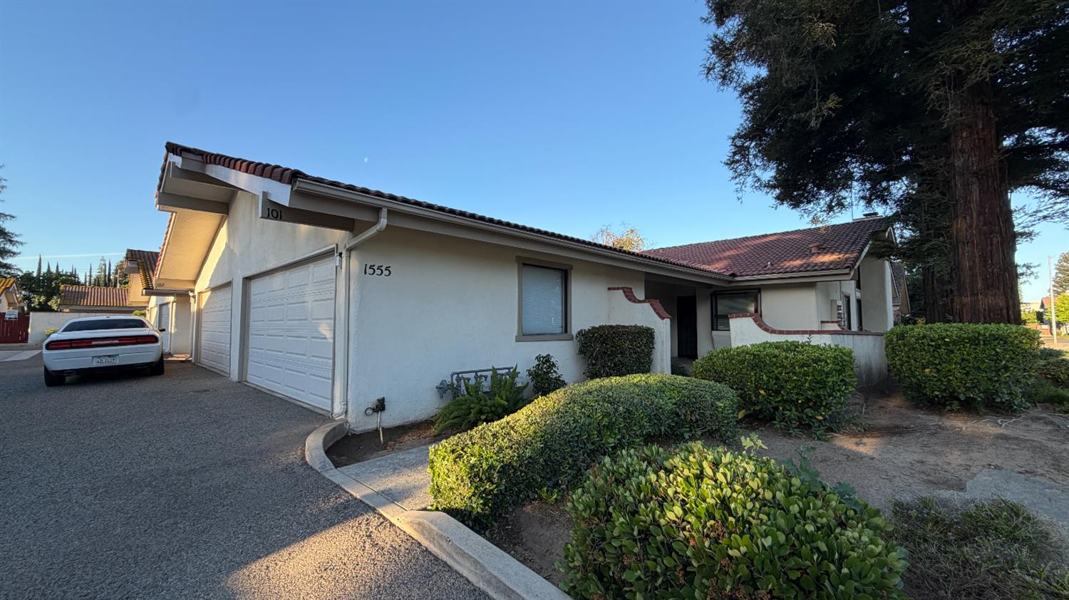 1555 West Boston Avenue, Unit 101 Fresno, CA 93711 - Photo 4 of 20 a view of a house with a yard