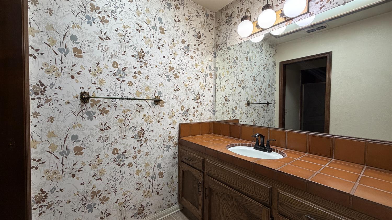 1555 West Boston Avenue, Unit 101 Fresno, CA 93711 - Photo 10 of 20 a bathroom with a sink and a mirror