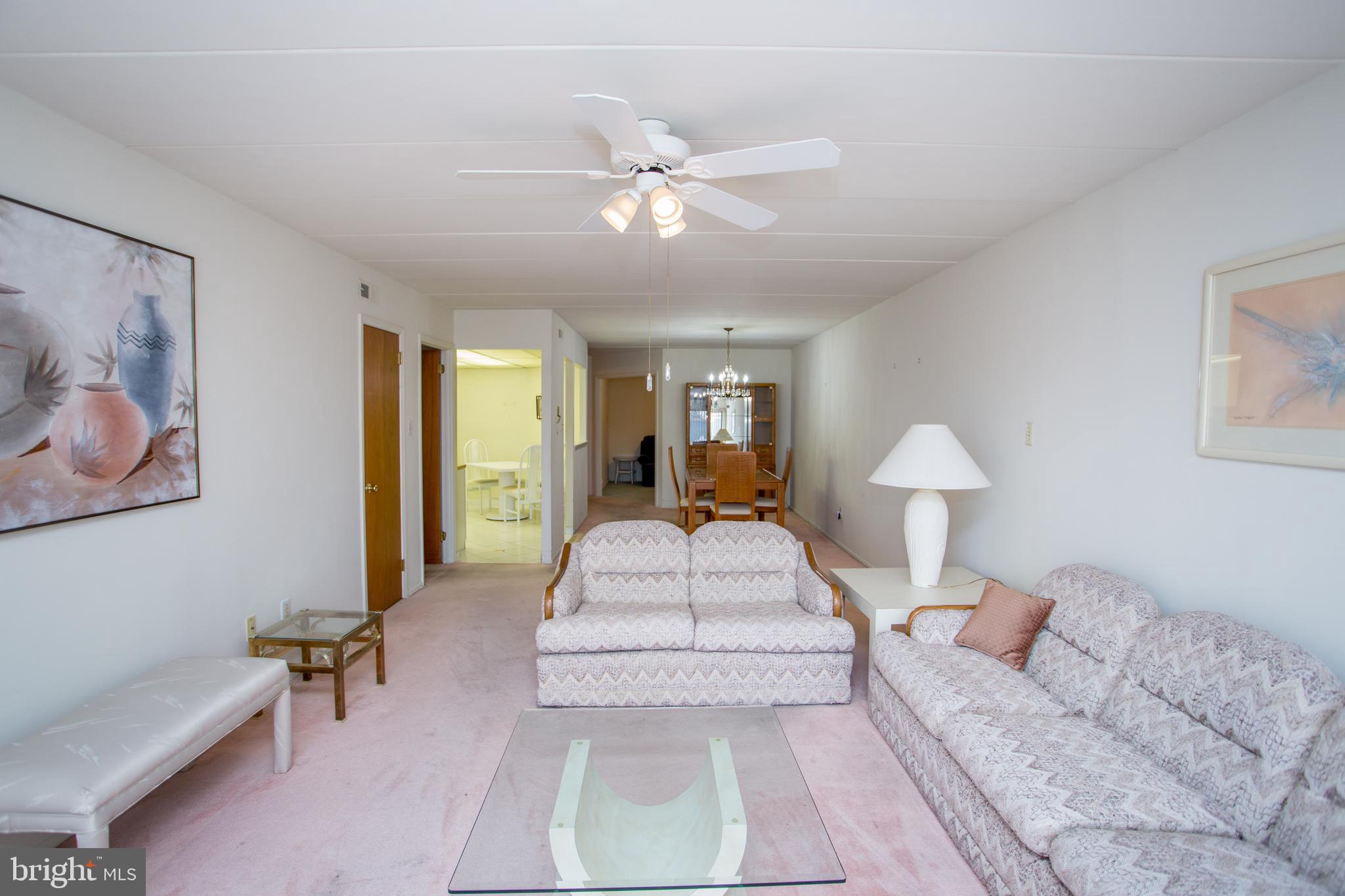 2131 Welsh Road, Unit 207 Philadelphia, PA 19115 - Photo 18 of 46 a living room with furniture and a large window
