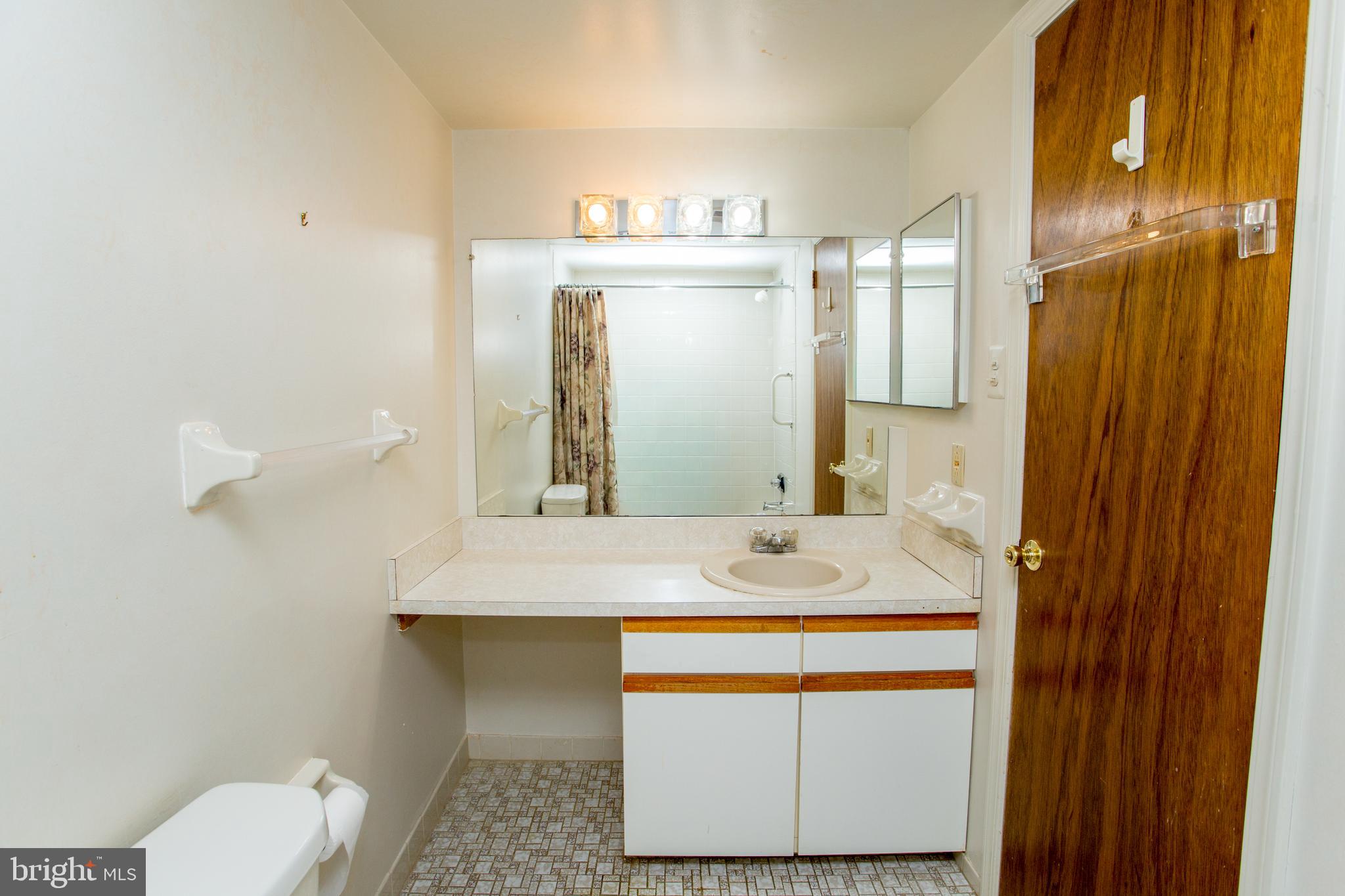 2131 Welsh Road, Unit 207 Philadelphia, PA 19115 - Photo 37 of 46 a bathroom with a sink and a mirror