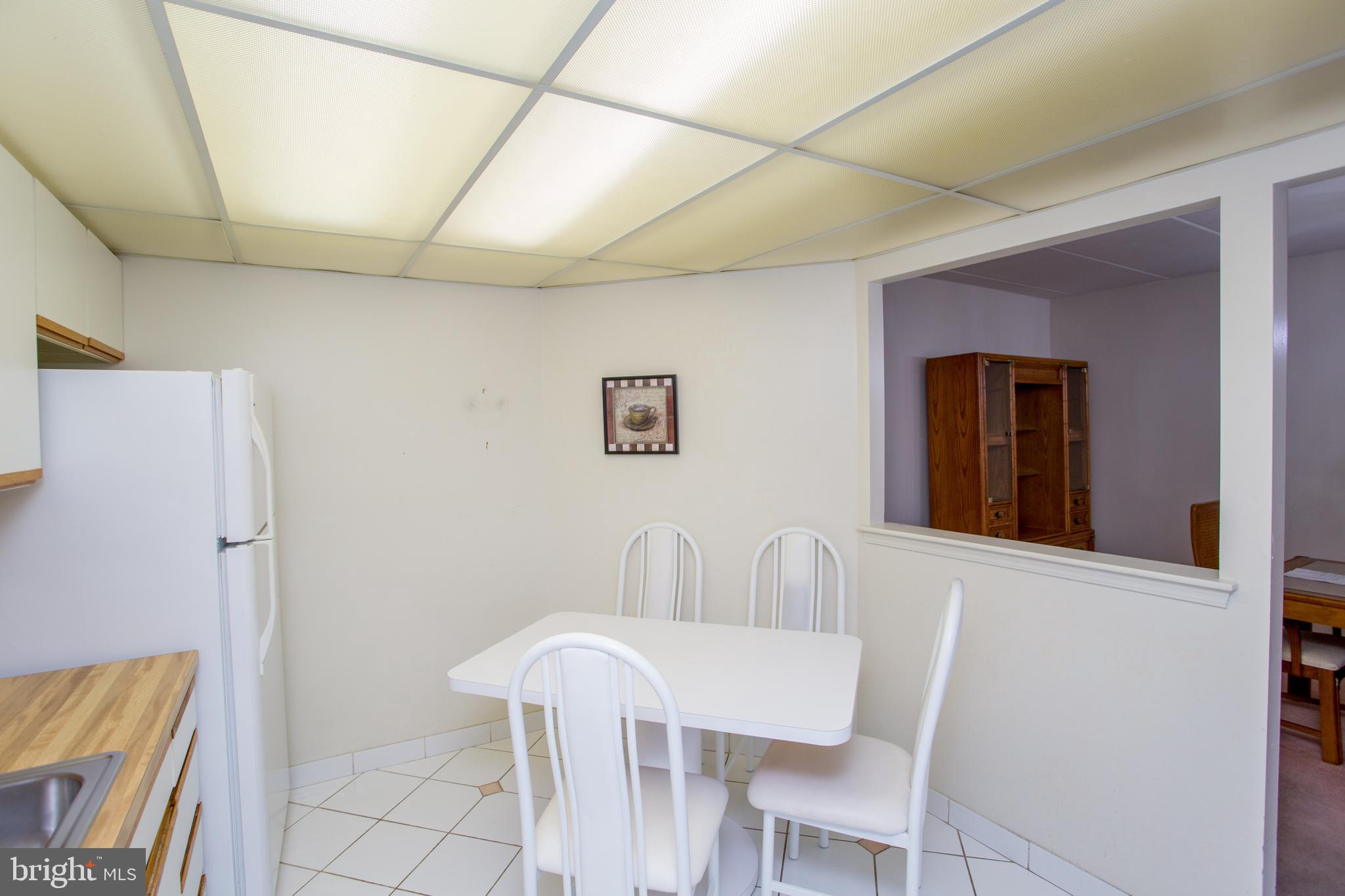 2131 Welsh Road, Unit 207 Philadelphia, PA 19115 - Photo 39 of 46 a view of a dining room with furniture