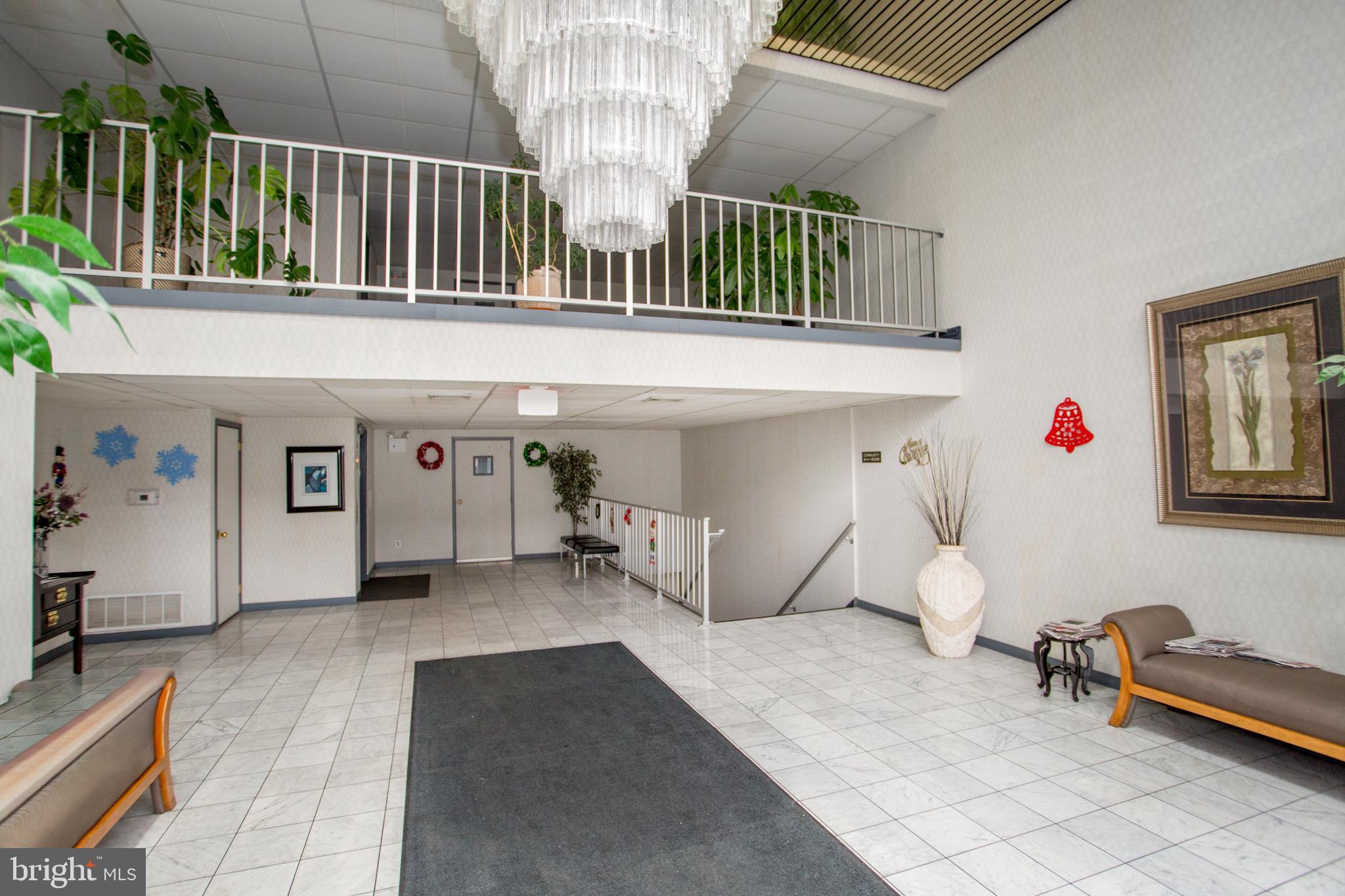 2131 Welsh Road, Unit 207 Philadelphia, PA 19115 - Photo 4 of 46 a view of a livingroom with furniture and staircase