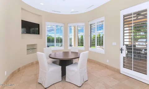 a dining room with furniture and window