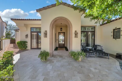 a view of a house with potted plants