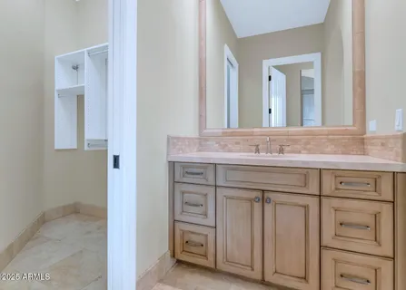 a bathroom with a glass shower door
