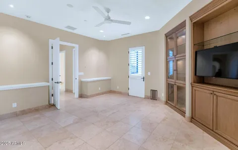 a bathroom with a granite countertop sink a toilet and bathtub