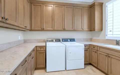 an aerial view of a house with garden space ocean view