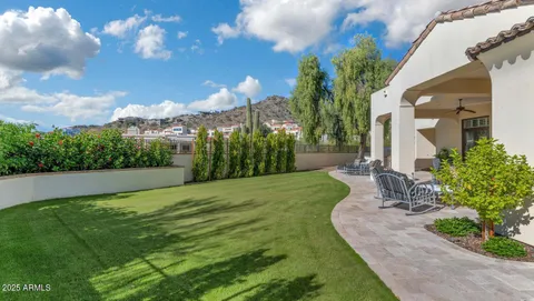 an aerial view of residential houses with outdoor space and street view