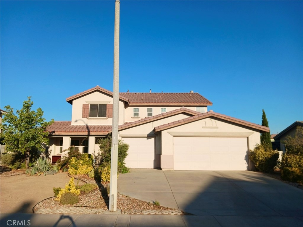 a front view of a house with yard
