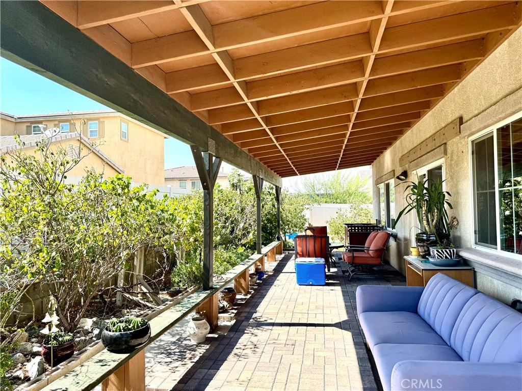37041 Populus Avenue Palmdale, CA 93552 - Photo 13 of 30 a building outdoor space with patio furniture