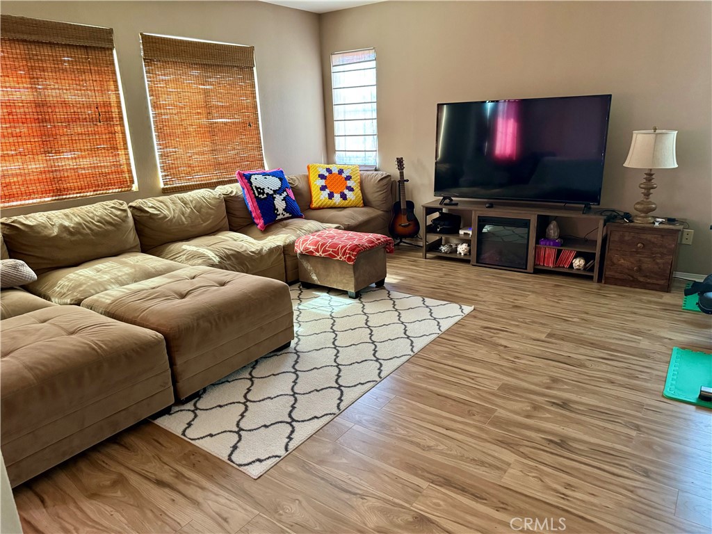 37041 Populus Avenue Palmdale, CA 93552 - Photo 19 of 30 a living room with furniture and a flat screen tv