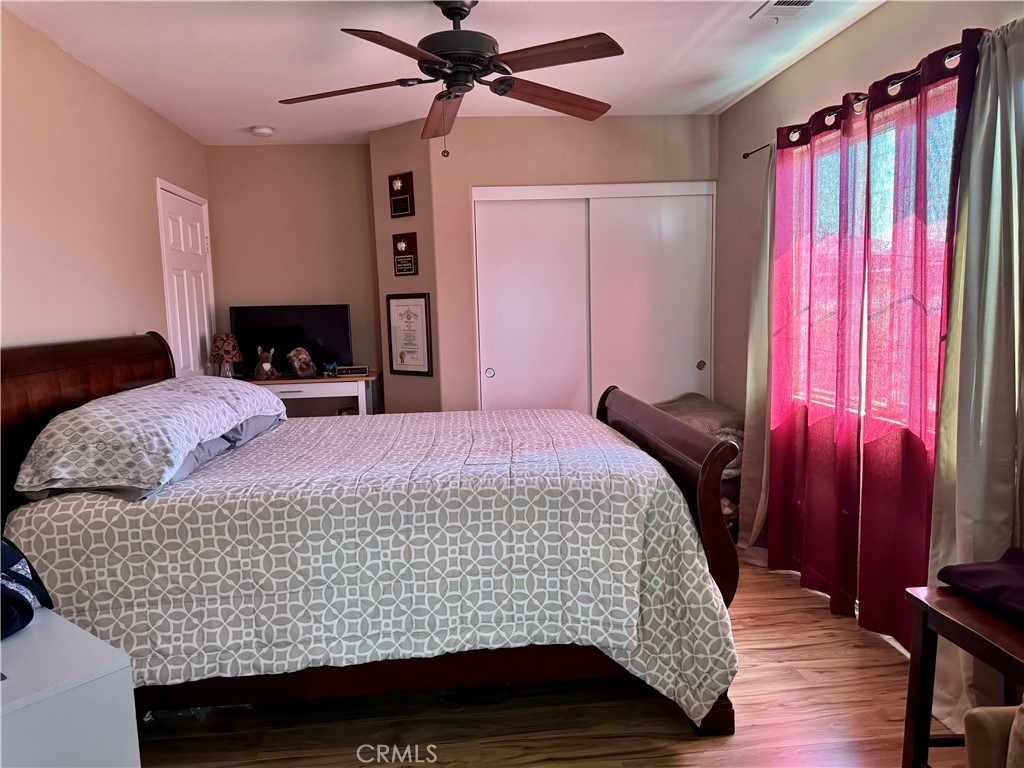 37041 Populus Avenue Palmdale, CA 93552 - Photo 20 of 30 a bed sitting in a bedroom next to a window