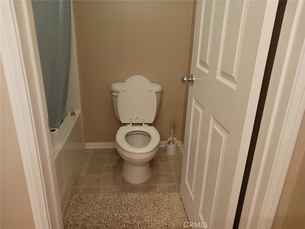 37041 Populus Avenue Palmdale, CA 93552 - Photo 29 of 30 a white toilet sitting next to a sink