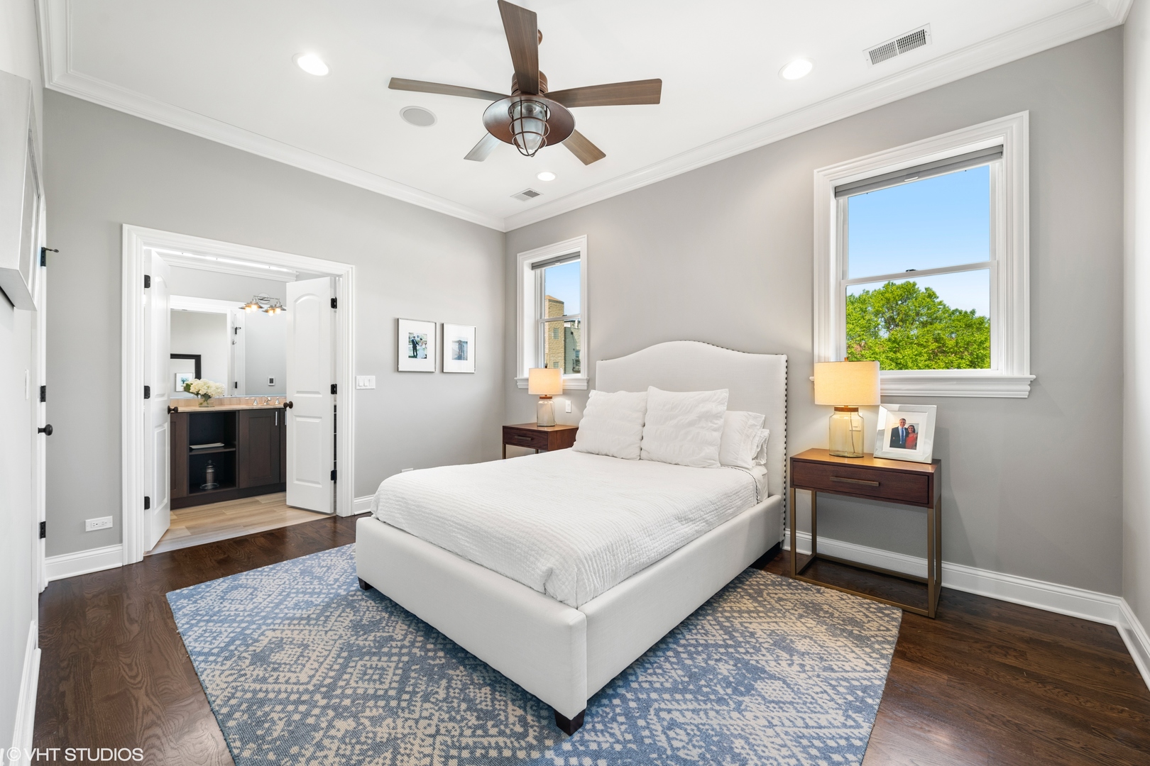 1944 West Fletcher Street, Unit 3E Chicago, IL 60657 - Photo 13 of 28 a bedroom with a large bed and a chandelier