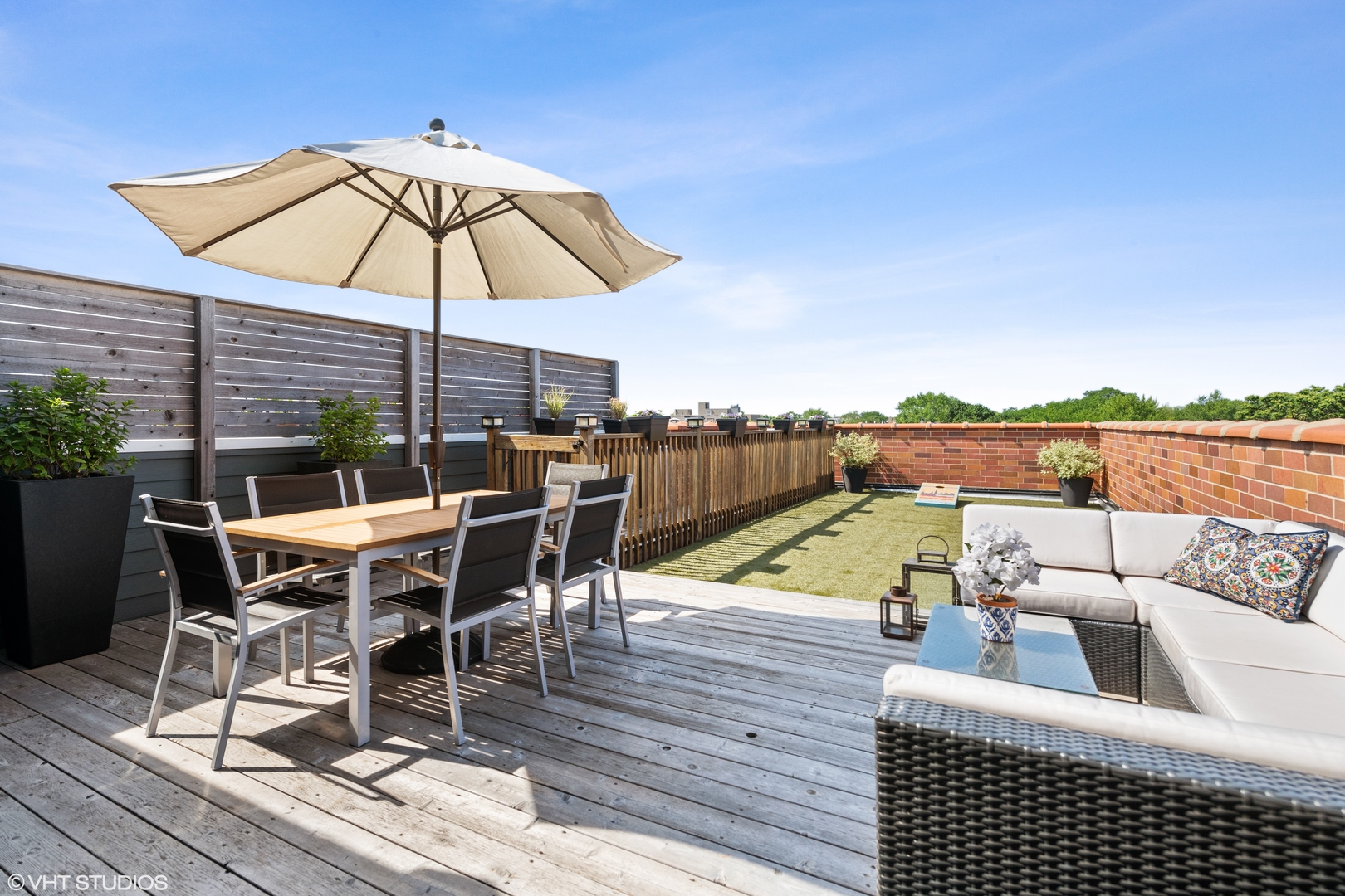1944 West Fletcher Street, Unit 3E Chicago, IL 60657 - Photo 22 of 28 a view of a roof deck with dining table and chairs