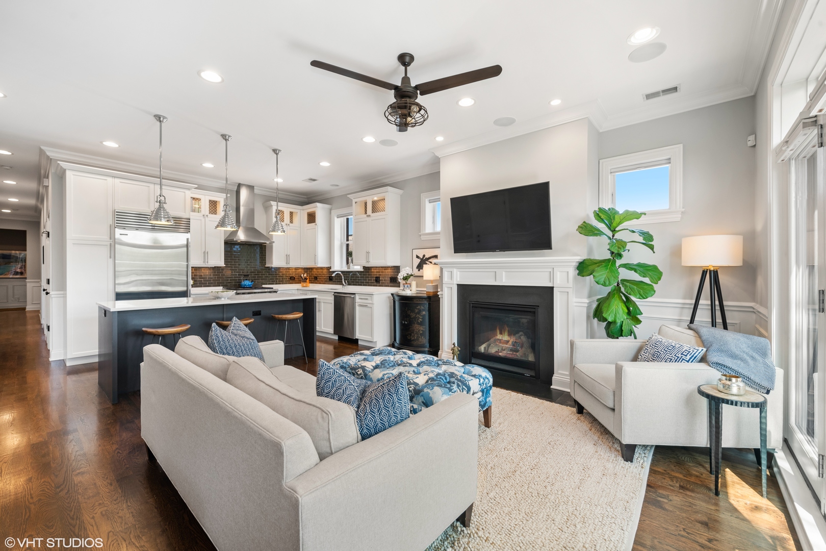1944 West Fletcher Street, Unit 3E Chicago, IL 60657 - Photo 6 of 28 a living room with furniture a fireplace and a flat screen tv