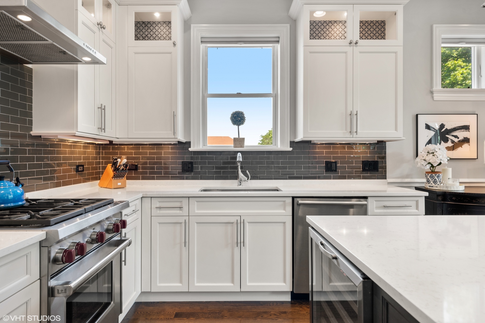 1944 West Fletcher Street, Unit 3E Chicago, IL 60657 - Photo 9 of 28 a kitchen with stainless steel appliances granite countertop a sink stove and cabinets
