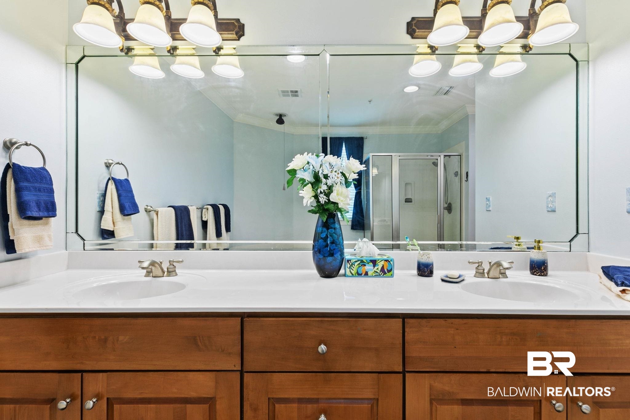 28250 Canal Road, Unit 208 Orange Beach, AL 36561 - Photo 31 of 53 Full bath featuring double vanity, a stall shower, and ornamental molding