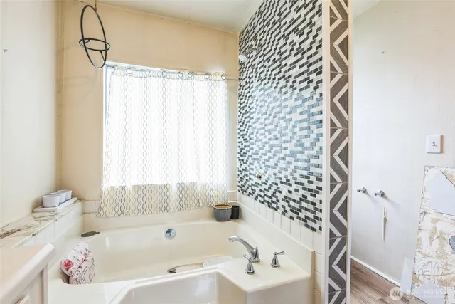 a bathroom with a sink and a bathtub