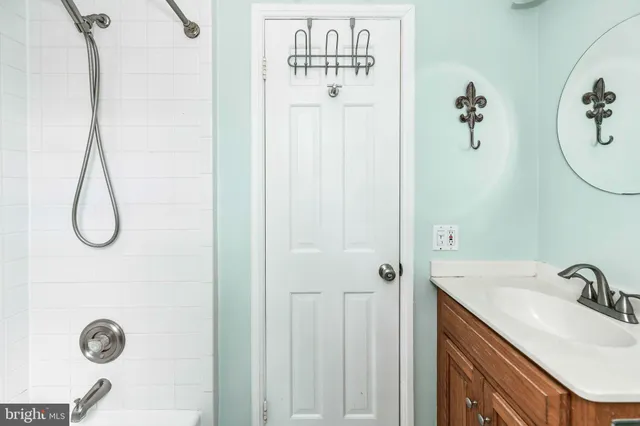 a bathroom with a sink and mirror