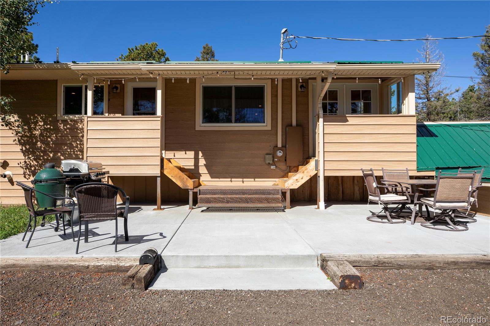 12322 South Wamblee Valley Road Conifer, CO 80433 - Photo 11 of 37 a view of a lounge chairs in the back yard of the house