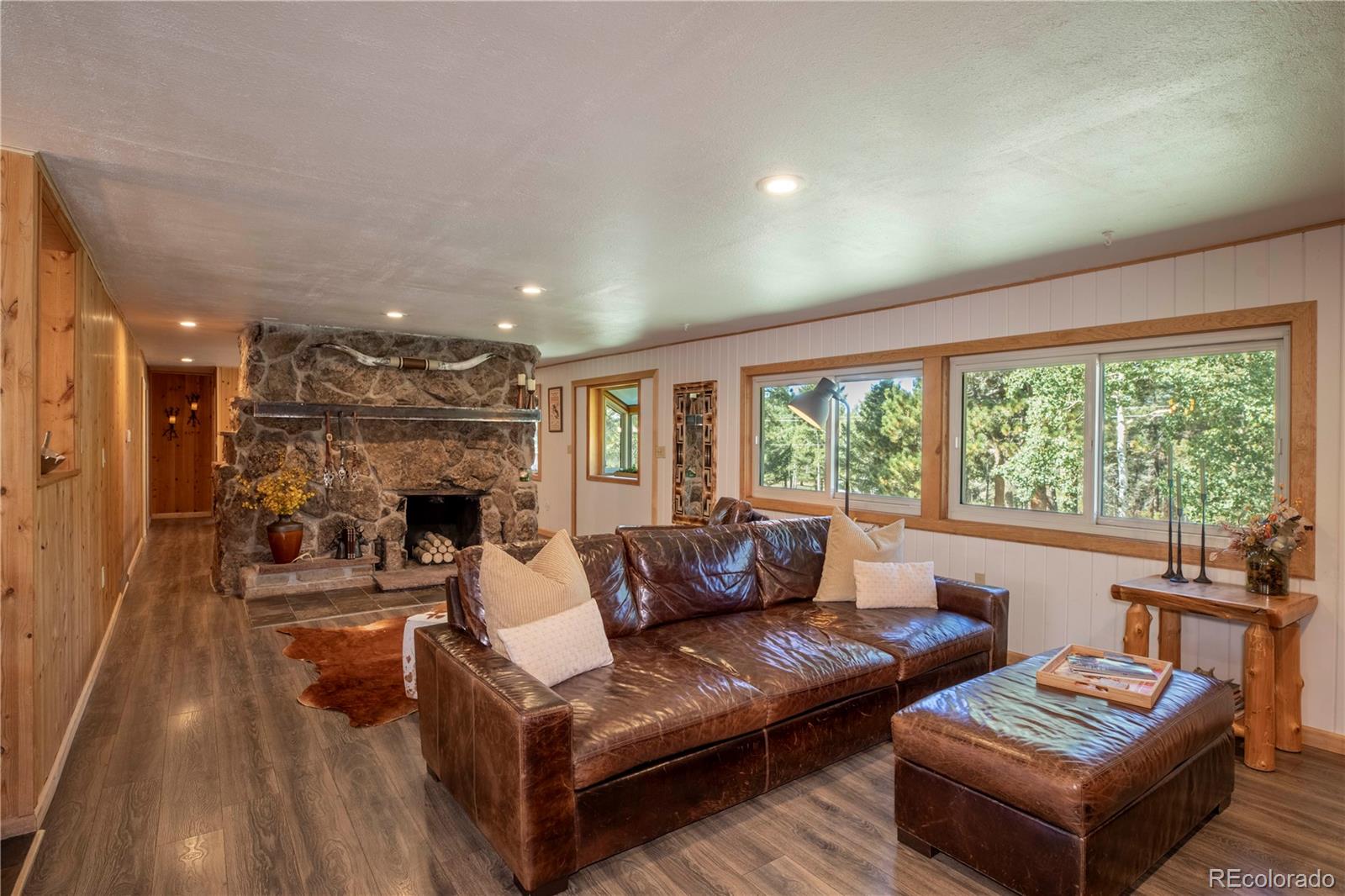 12322 South Wamblee Valley Road Conifer, CO 80433 - Photo 13 of 37 a living room with furniture and a large window