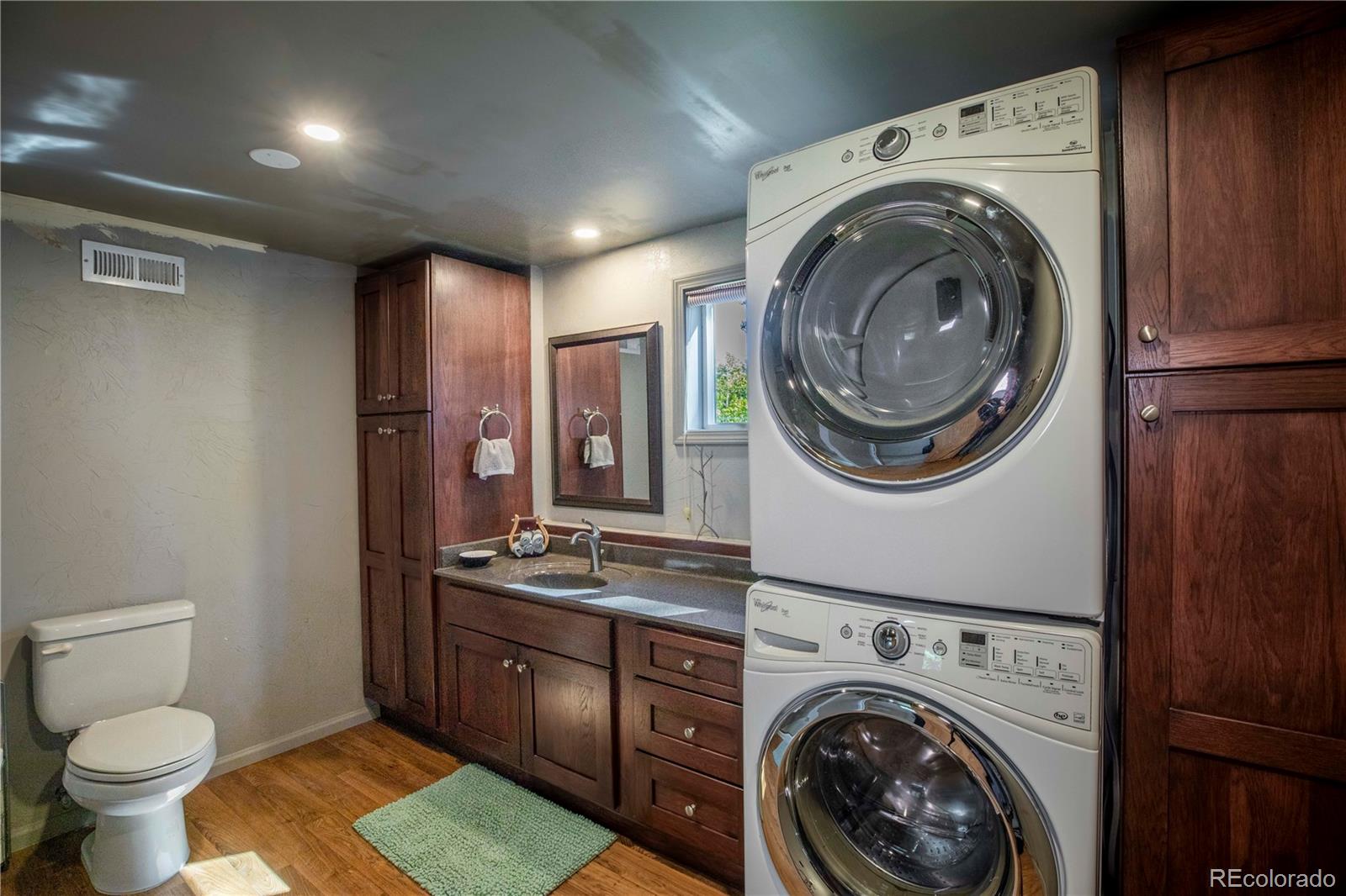 12322 South Wamblee Valley Road Conifer, CO 80433 - Photo 32 of 37 a view of a storage & utility room with a washer and dryer